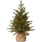 National Tree Company Pre-Lit 'Feel Real' Artificial Mini Christmas Tree, Green, Nordic Spruce, White Lights, Includes Burlap Bag Base, 3 Feet